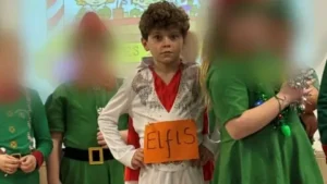 A kid dressed as elvis