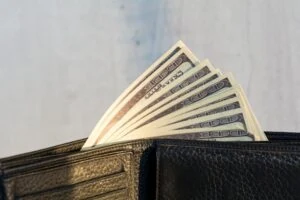 A wallet with money sticking out of it
