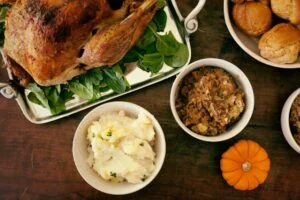 Different Thanksgiving Sides spread out on a table