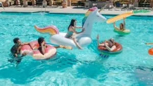 A group of people having fun in the pool